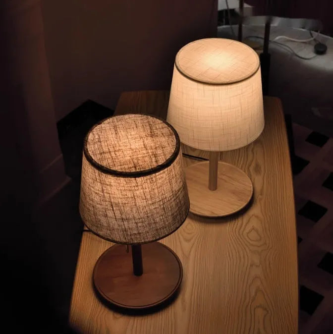 Walnut solid wood bedside lamp with cloth lampshade on wooden table