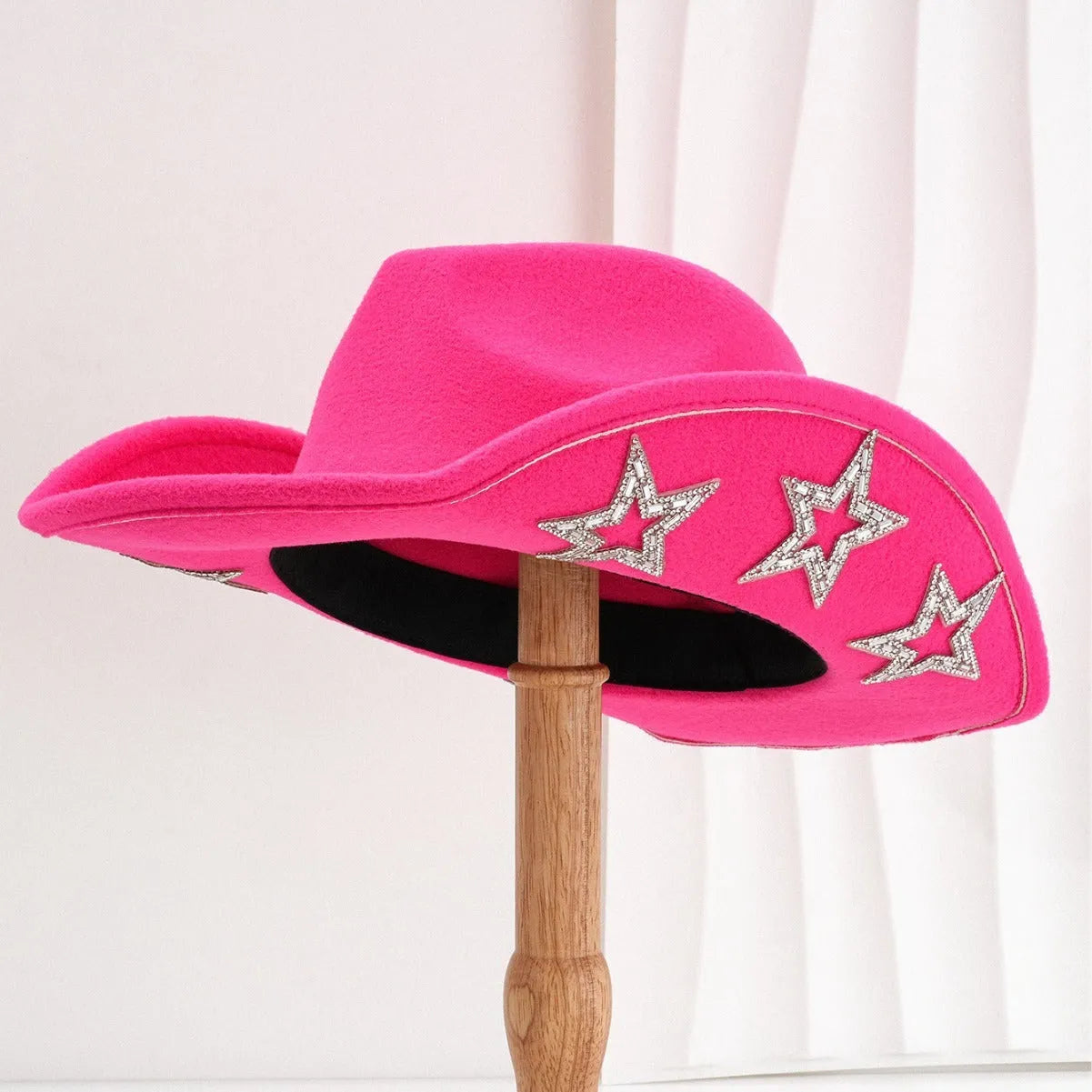 Polyester western top hat with conical crown and hexagonal star detail in size M.