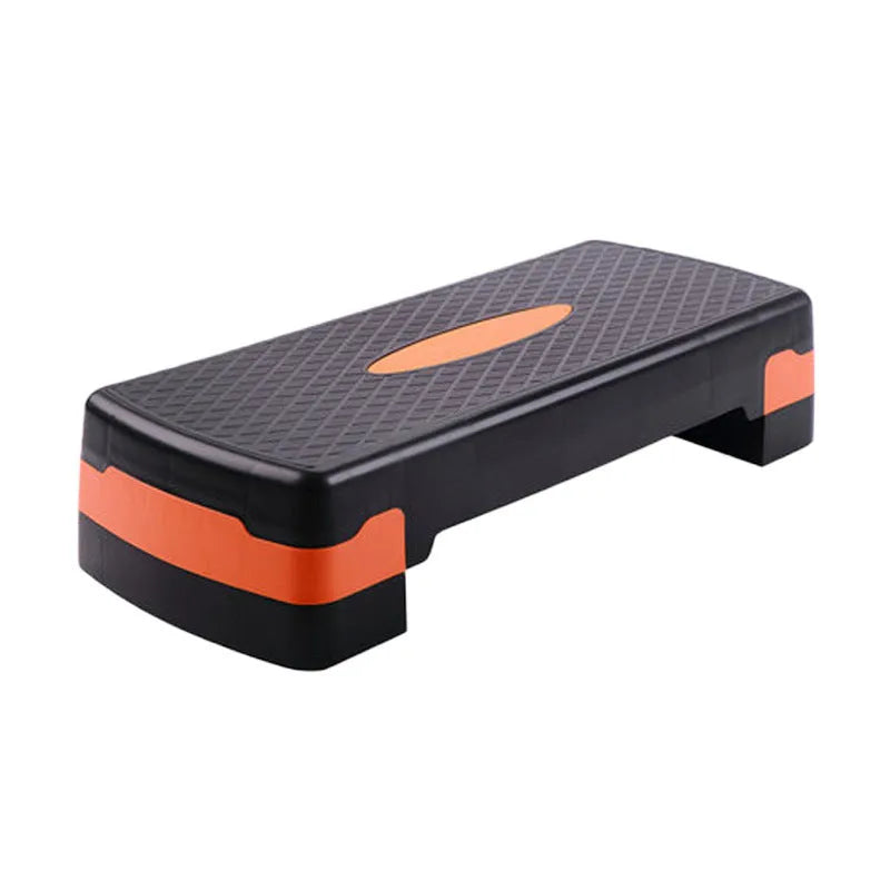 Grey fit step aerobic platform for yoga and fitness exercises on wooden floor