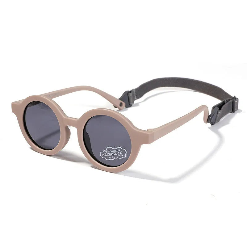 Round frame polarised sunglasses for toddlers aged 0-3 years with UV400 protection, shown in multiple colour options.