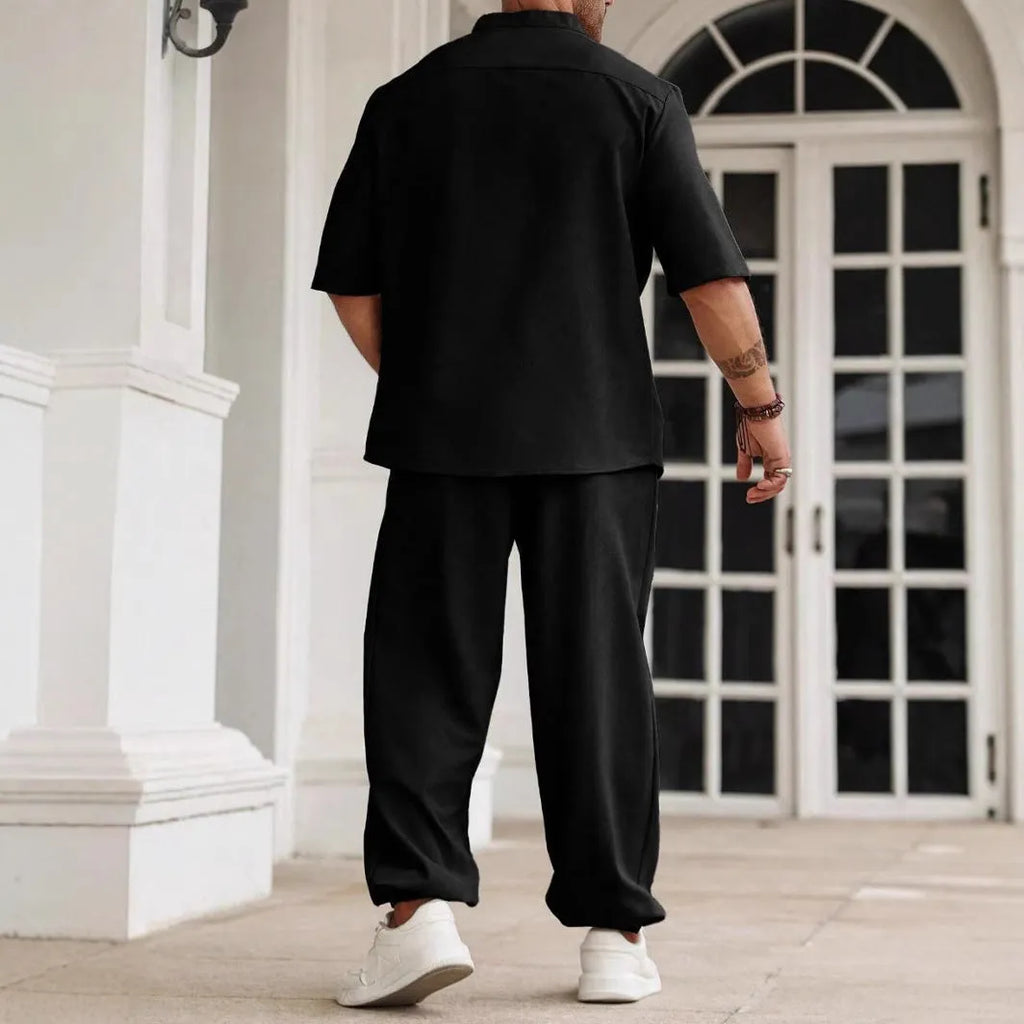 Men's apricot coloured cotton linen short sleeve shirt and trouser casual set laid flat.