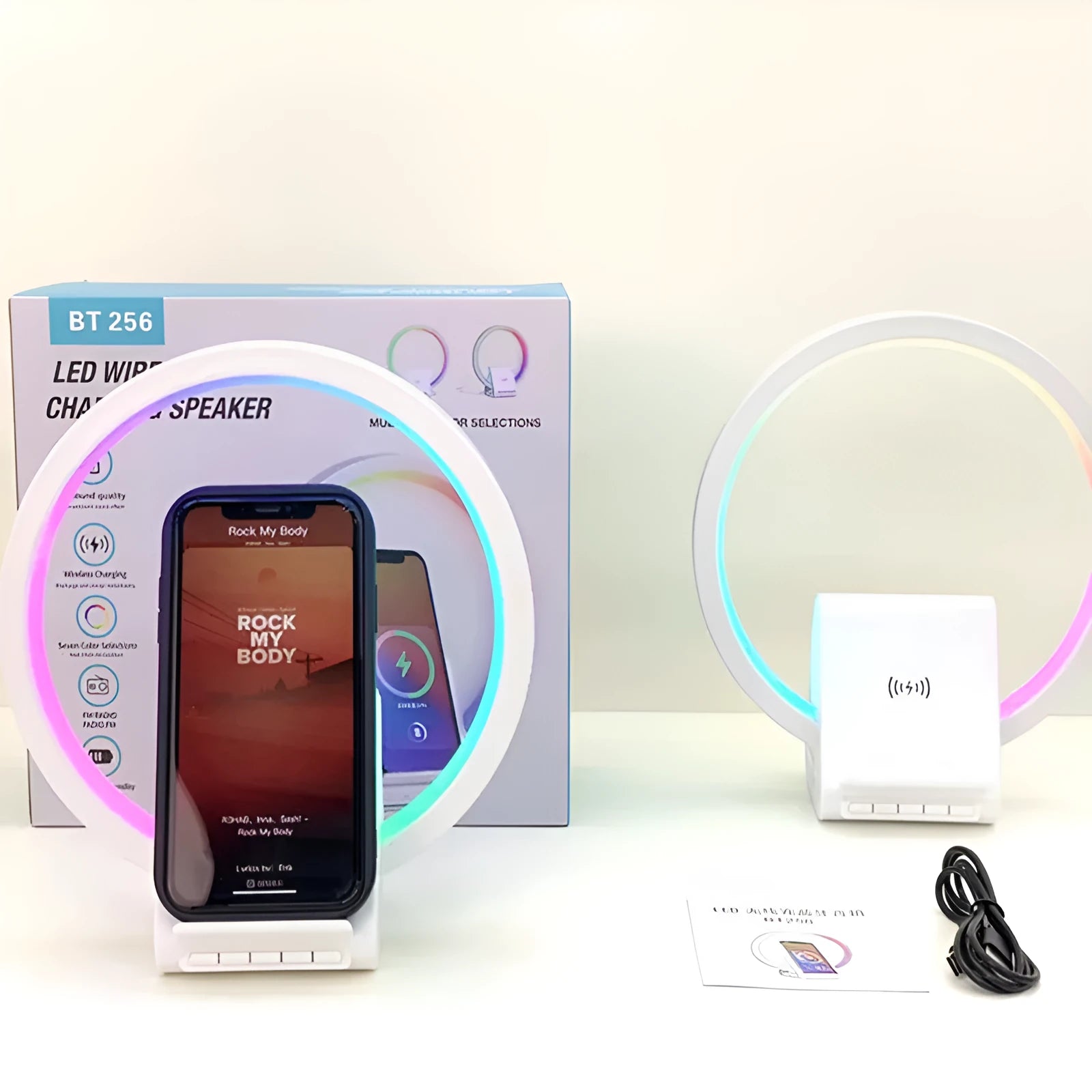 White smart Bluetooth speaker with built-in ambient light and 15W wireless charging pad on top.