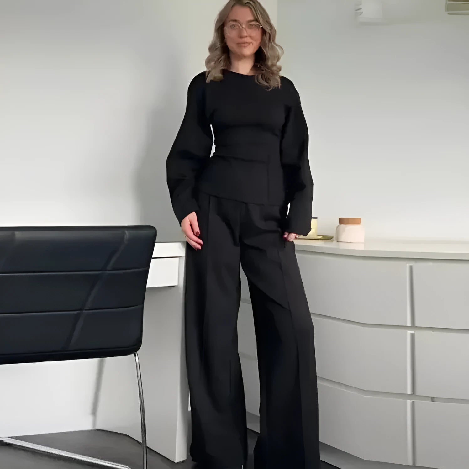 Women's black polyester fleece two-piece suit with long sleeve top and wide-leg trousers