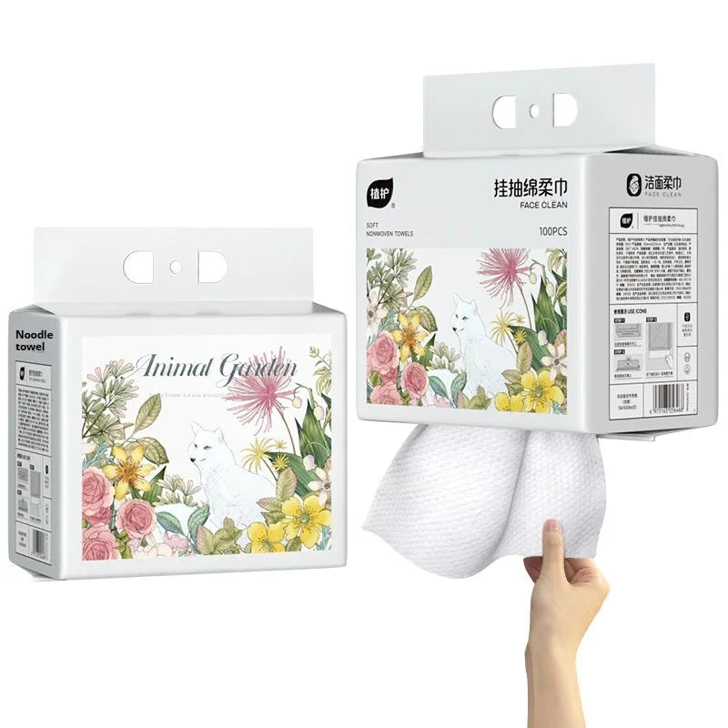 Roll of 100 disposable soft face cloths with a hook for hanging, shown in a soft cotton colour.