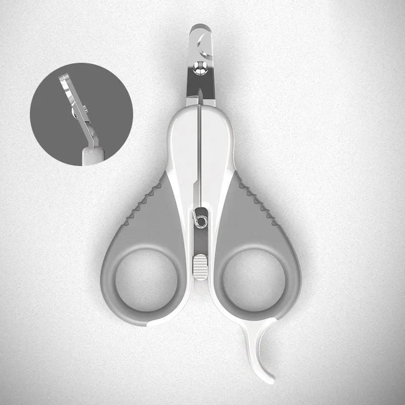 Grey and pink cat nail clippers with angled blade and safety guard on a table.
