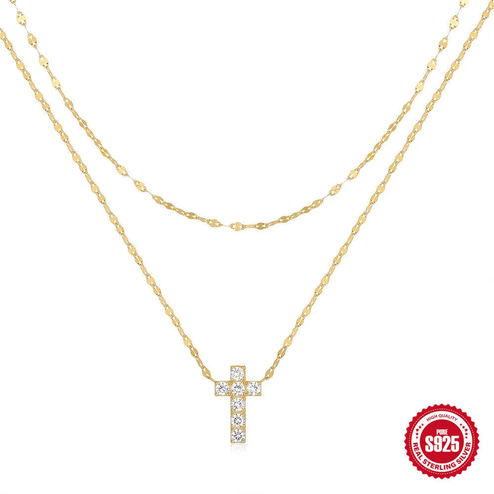 Sterling silver double layer twin diamond cross pendant on a clavicle chain.