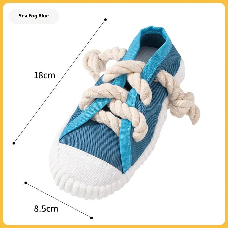 Plastic dog chew toy shaped like a slipper in yellow, black, and blue colour options.