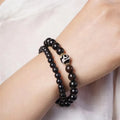 8mm ebony wood two-circle unisex retro bracelet on a white background