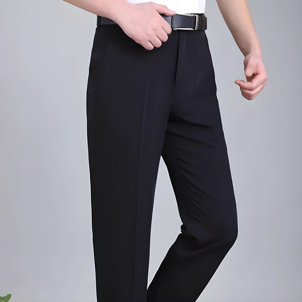 Man wearing dark blue straight-leg mulberry silk blend suit trousers with a high waist.