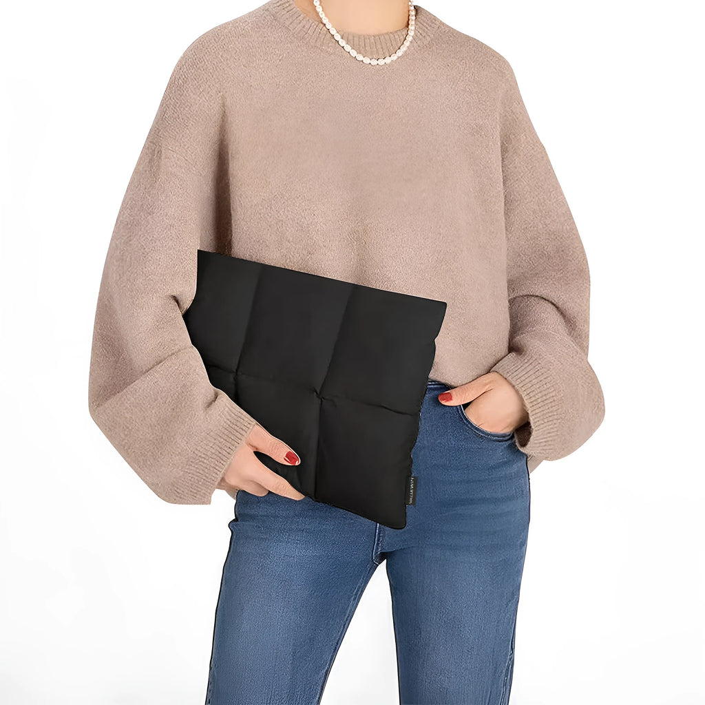 Soft black fluffy laptop sleeve case for a 15.6 inch laptop, showing sewing thread detail.