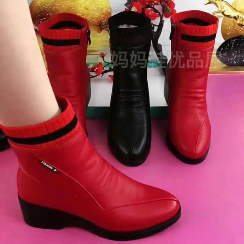 Women's soft leather ankle boots with mid heel, side zipper, and square heel in black