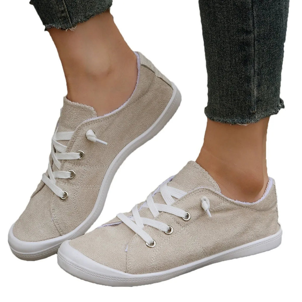Women's creamy-white fabric casual sneakers with low-top design and rubber sole