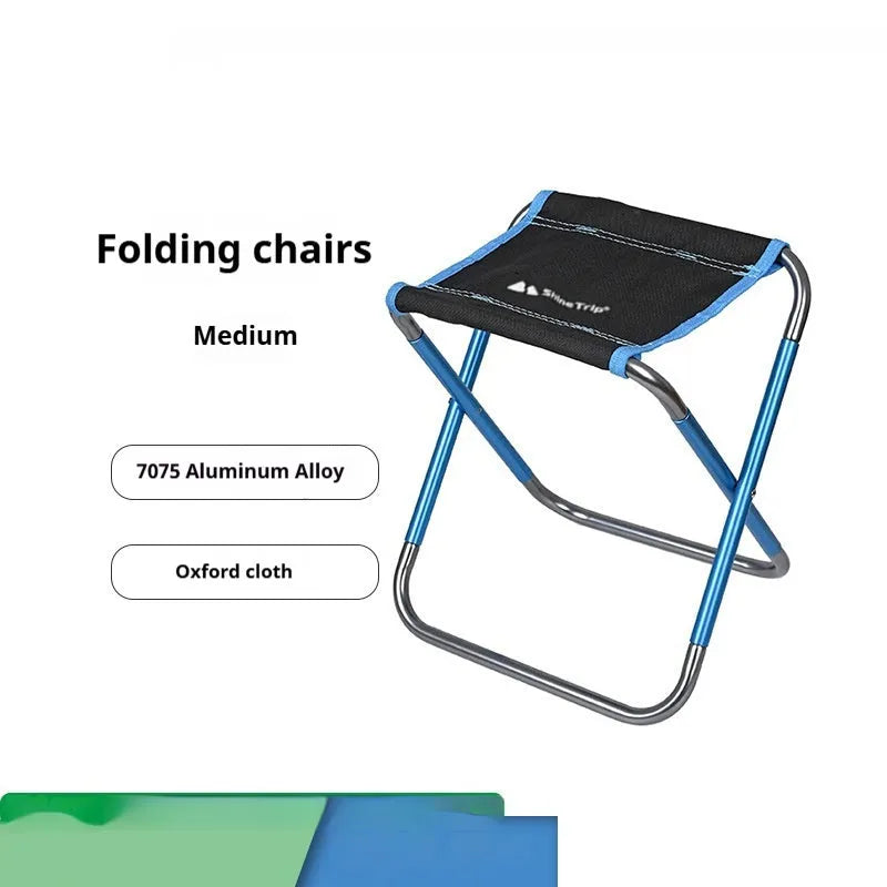 Black national style folding camping stool with aluminium alloy frame in open position.