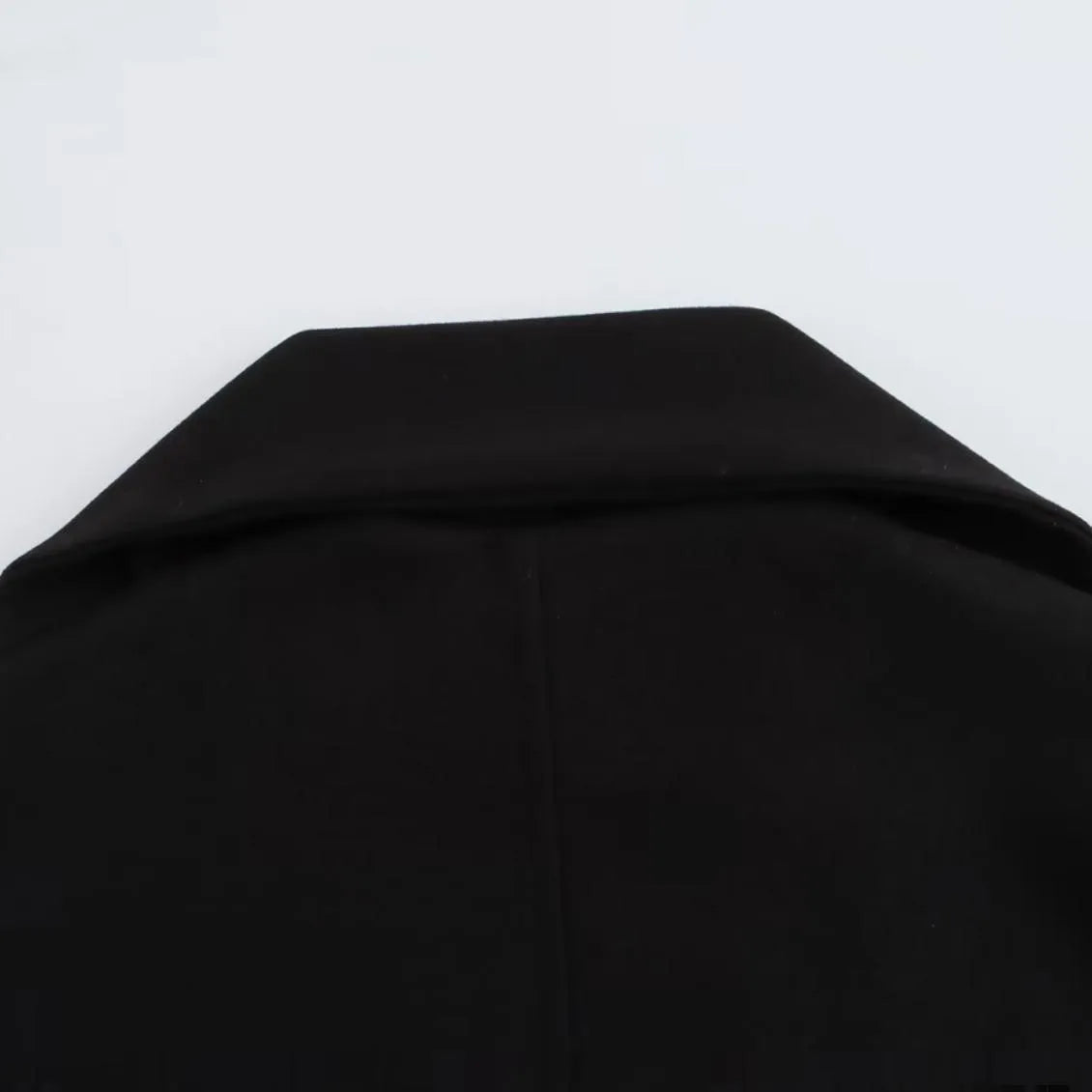 Women's long camel coat with a detachable artificial fur collar in a street fashion style.