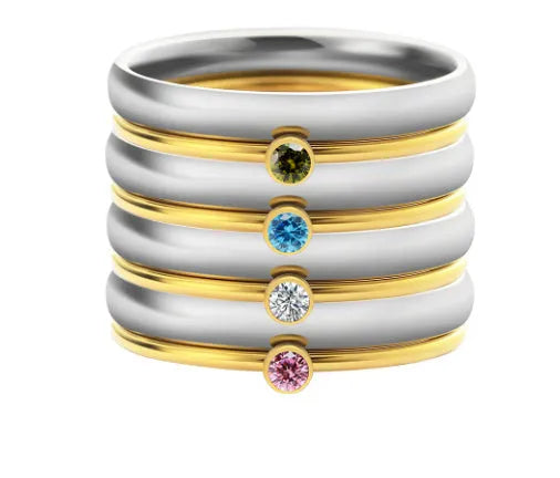 December birthstone colour geometric engraved titanium steel ring for women on a grey background.