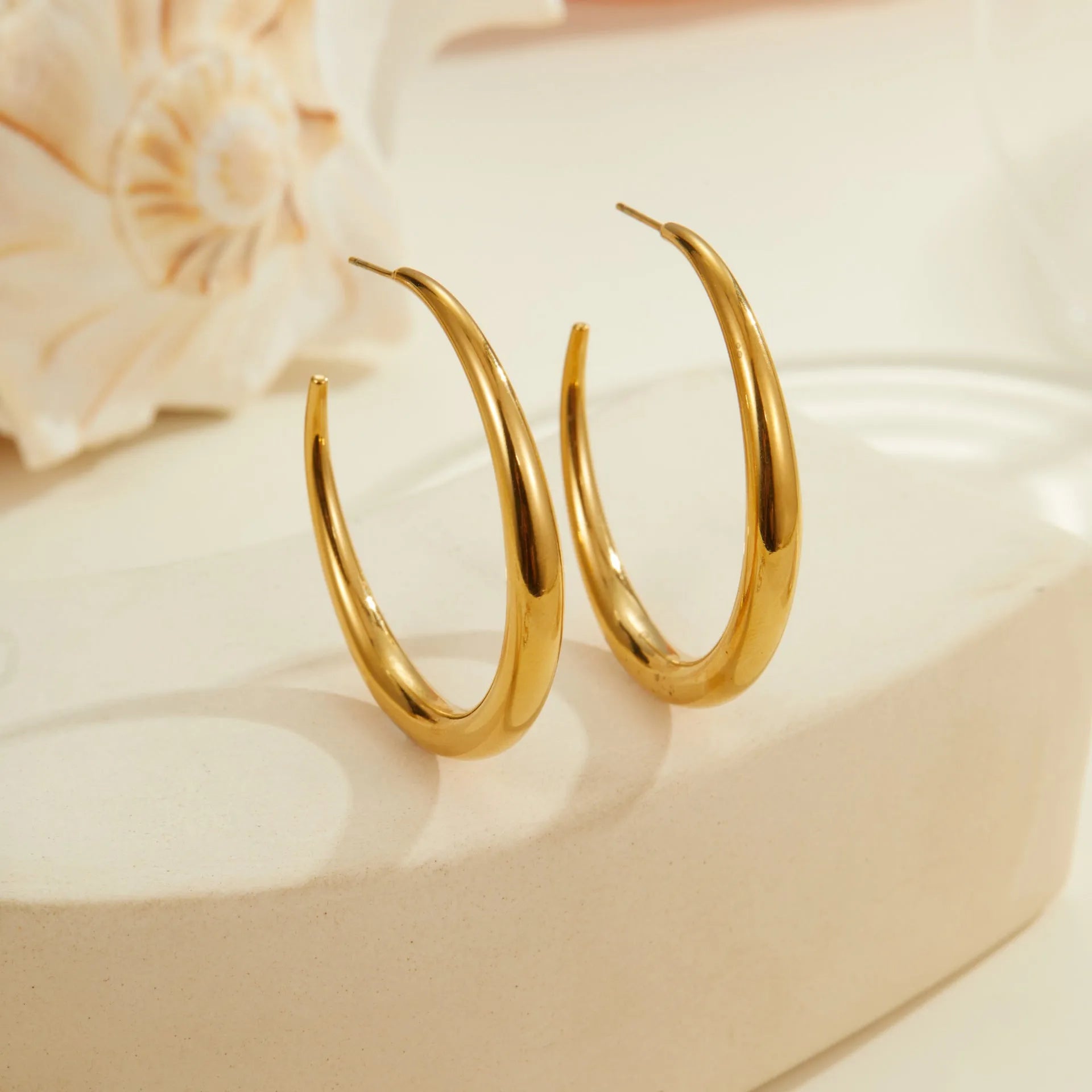 Titanium steel geometric round hoop earrings with 18K gold plating in small and large sizes