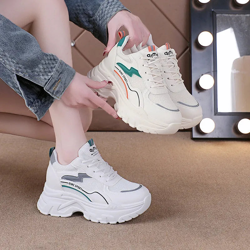 Women's white and beige breathable dad shoes with cross shoulder straps and a lace-up front.