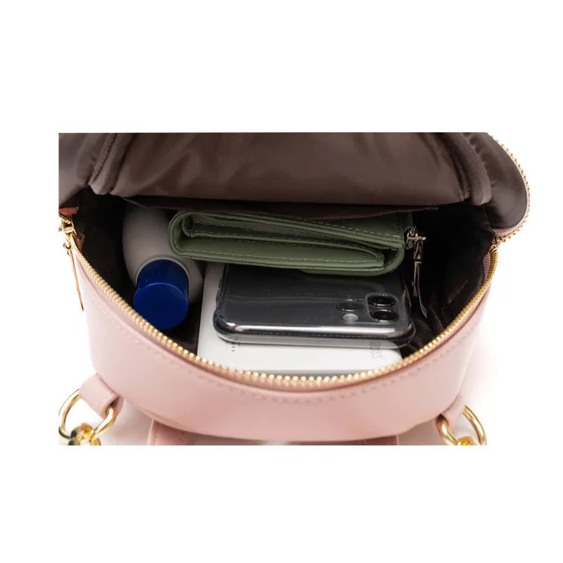 Soft PU mini backpack in street style with three-dimensional pocket and internal phone compartment