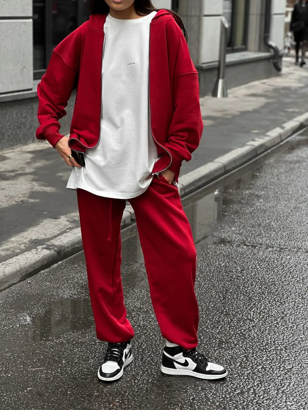 Red loose fit street style coat and trousers two-piece set on a model