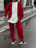 Red loose fit street style coat and trousers two-piece set on a model