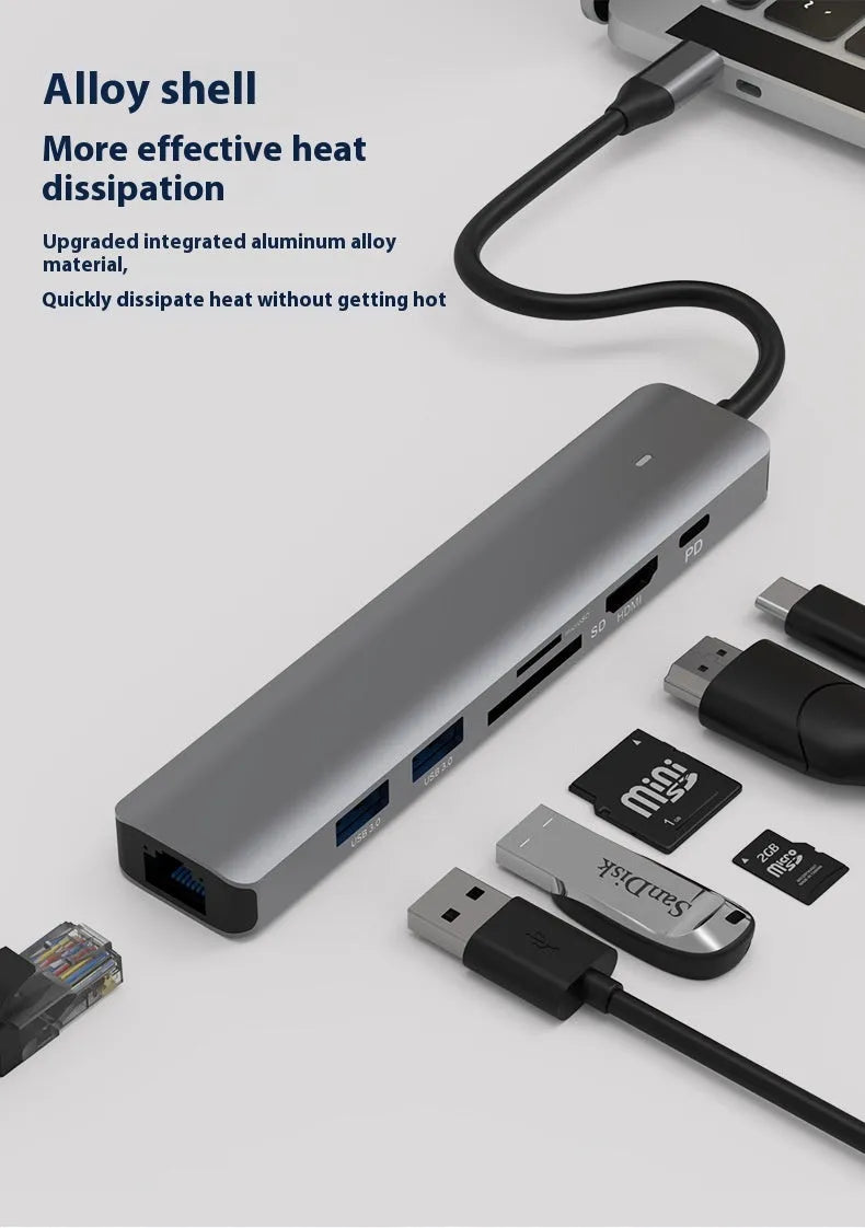 LQT-LH07 seven-in-one USB C hub and card reader adapter for laptops on a desk.