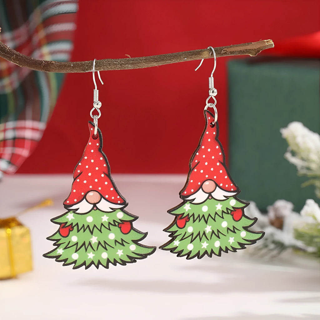Women's wooden Christmas earrings with printed tree and snowman designs on geometric shapes.