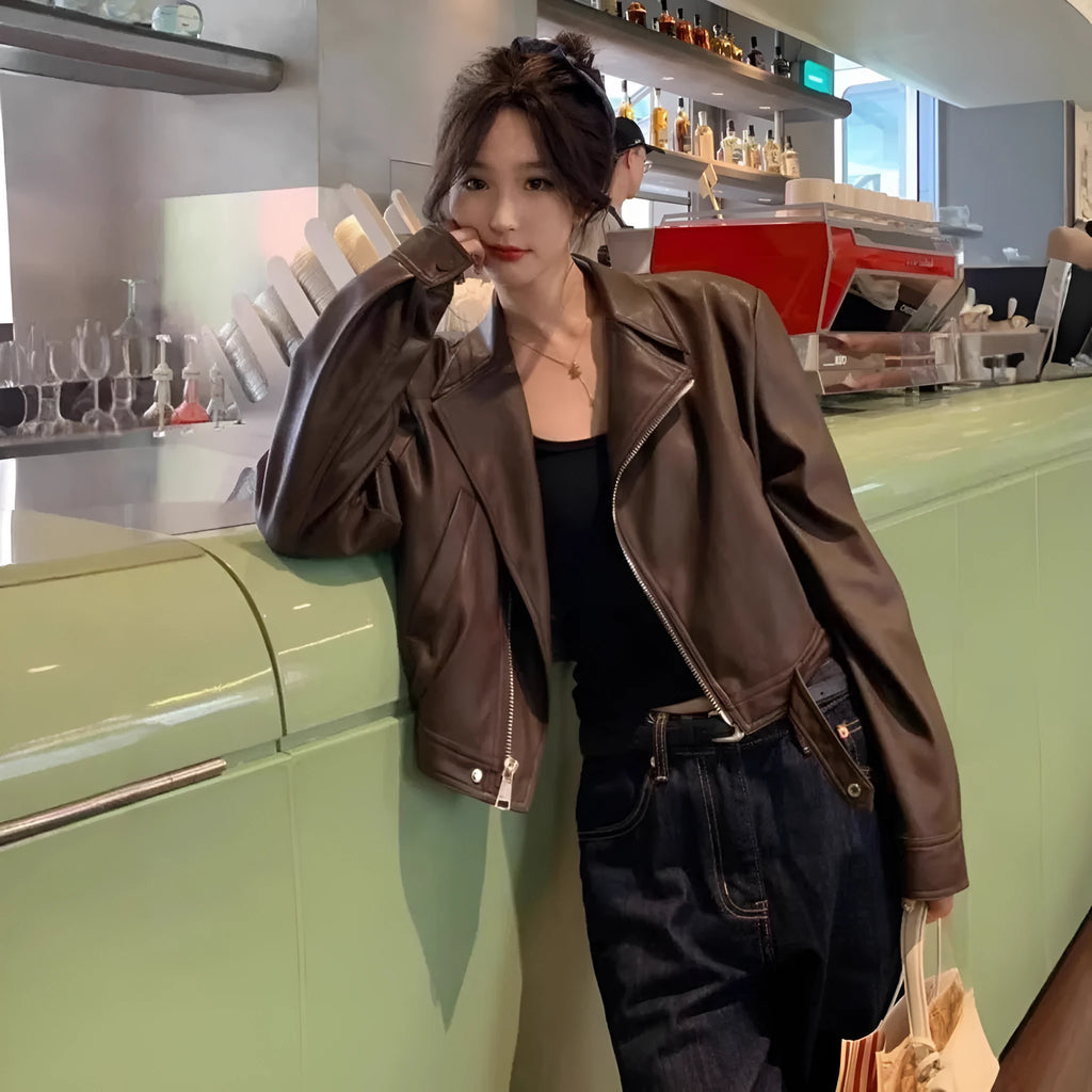 Women's brown retro imitation leather jacket with long sleeves and pocket details, slim fit.