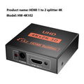 HDMI splitter device with one input and two output ports, USB power cable, and international plug adapters.