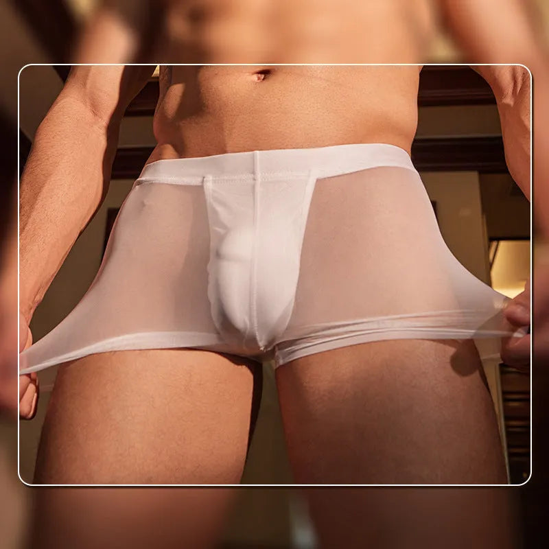 Men's black and white ultra-thin nylon boxer briefs laid flat showing low-rise waistband and leg openings.
