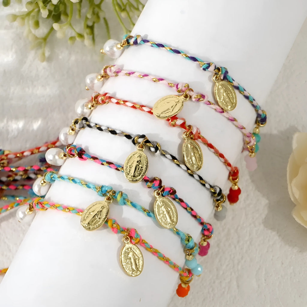 Close-up of hand-woven colourful braided rope bracelet with ethnic style and carrying strap tag function