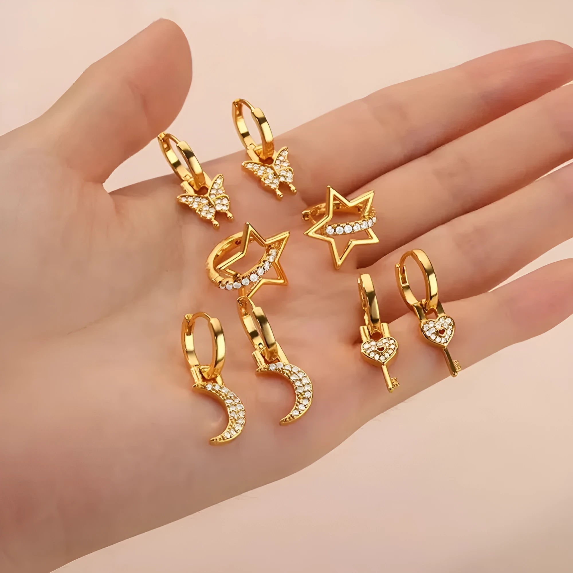 Geometric butterfly-shaped copper earrings for women with heart and star design details.