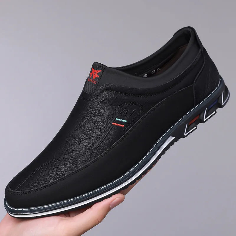 Men's casual leather slip-on shoes showing leather toe cap and sewing line detailing