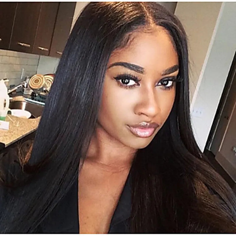 Long straight black synthetic wig with centre-parted bangs on mannequin head