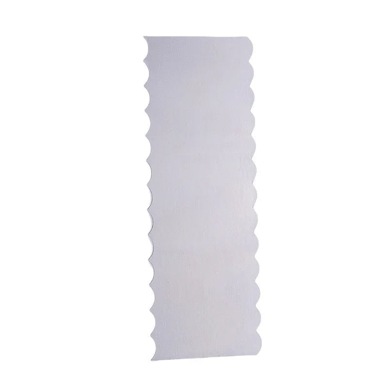 Stainless steel cream scraper with a polygonal patterned edge for cake decorating.