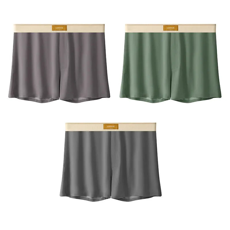 Pack of three pairs of solid colour men's loose fit ice silk underwear on a white background.