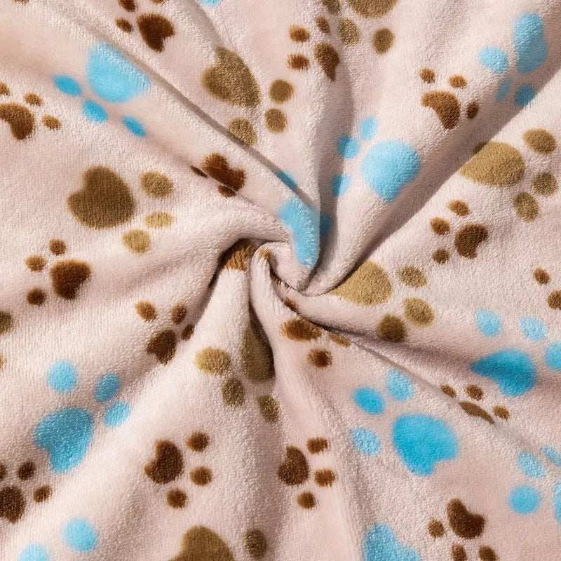 Blue dog cartoon pattern pet blanket laying flat, showing its double-sided thickened flannel texture.