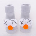 Cotton baby socks in blue bow design showing breathable fabric and size options for 0-3 month olds