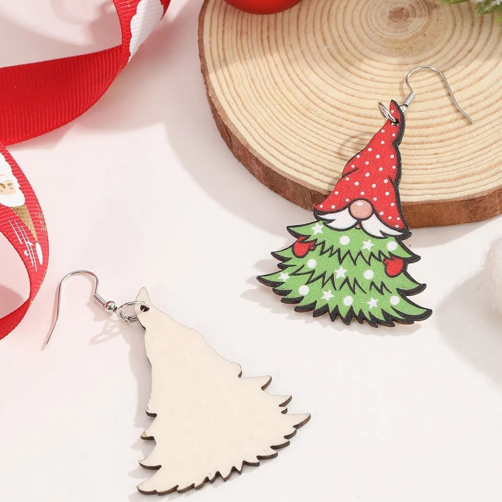 Women's wooden Christmas earrings with printed tree and snowman designs on geometric shapes.
