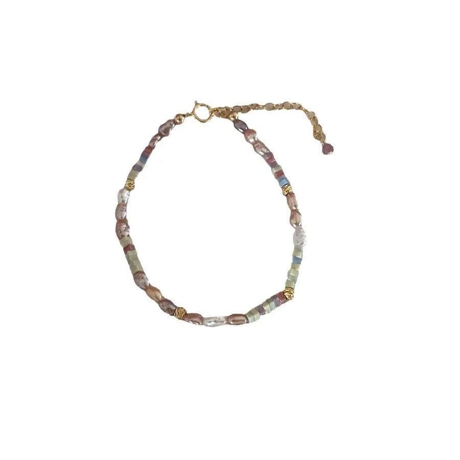 Natural pearl jewellery set with gilded 14K purple irregular mini pearls in bracelet and necklace