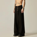 Men's solid black casual straight-leg trousers with a wide-leg fit and button fly on a neutral background.