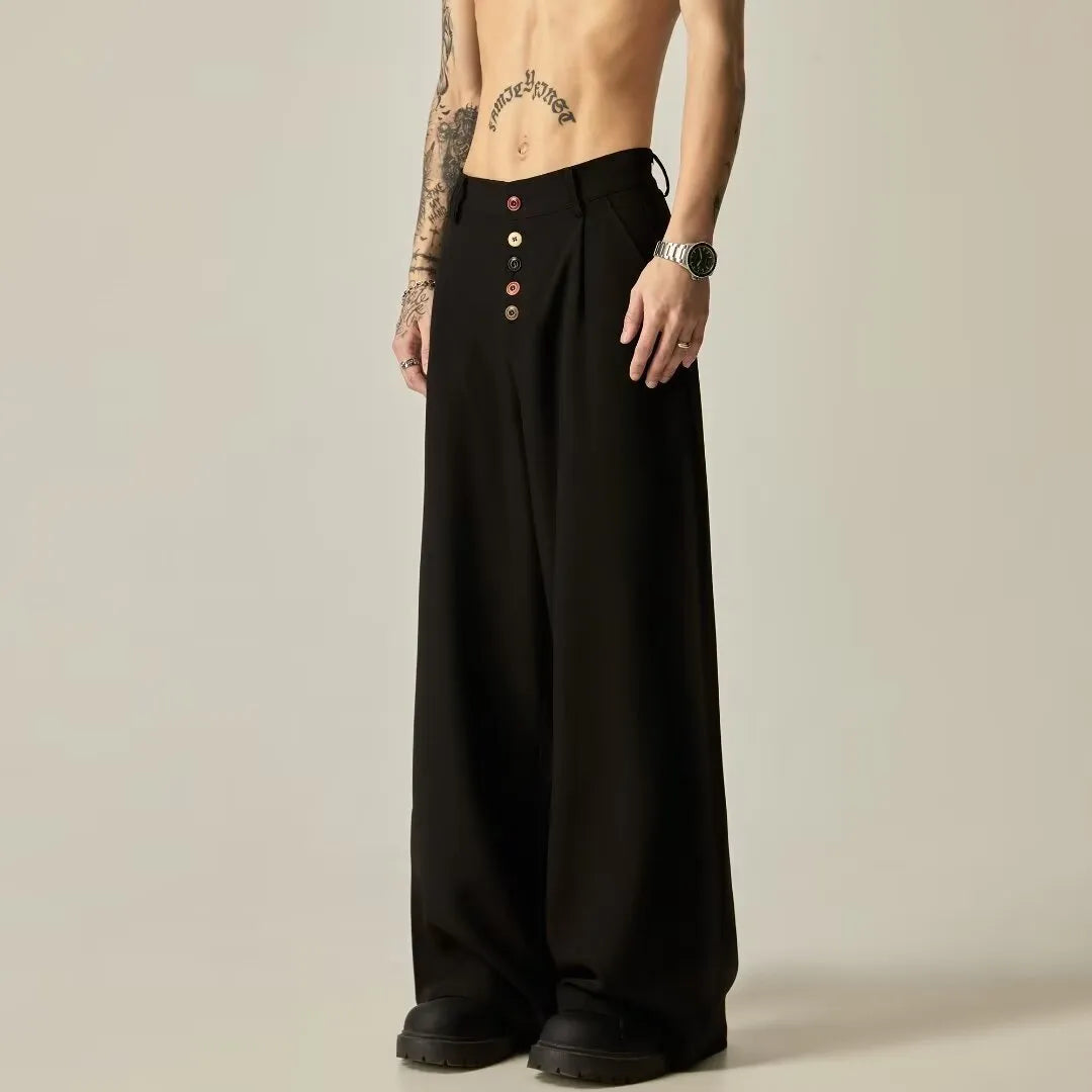 Men's solid black casual straight-leg trousers with a wide-leg fit and button fly on a neutral background.