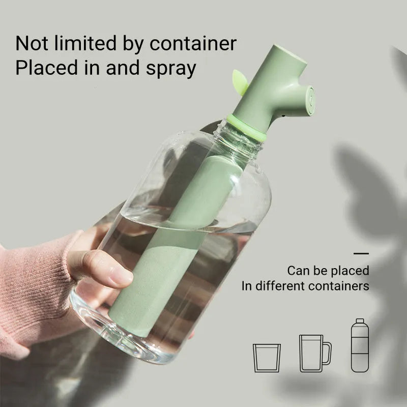 Mini portable USB air humidifier with branch nozzle, transparent plastic, 197mm tall, producing cool mist