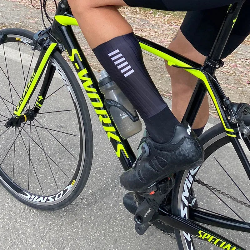 Athletic cycling socks in orange, black, purple, white, grey or dark blue with moisture-wicking fabric