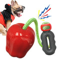 Green and red plastic apple-shaped dog toy with hollow centre for treats and squeaker