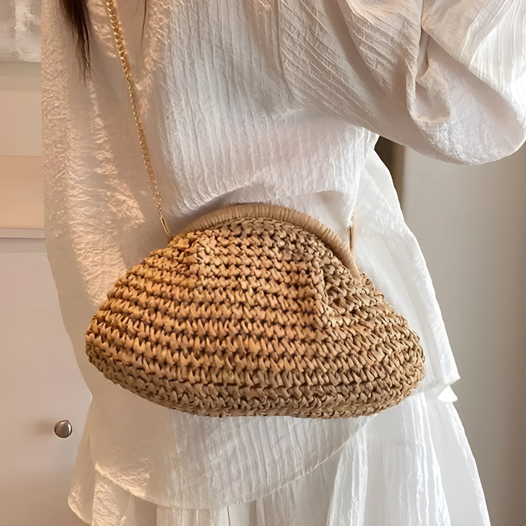 Khaki shell-shaped straw shoulder bag for women with chain detail and zippered pocket.