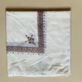 Printed square scarf in brown, 138x138cm polyester unisex scarf laid flat showing square shape and colour.