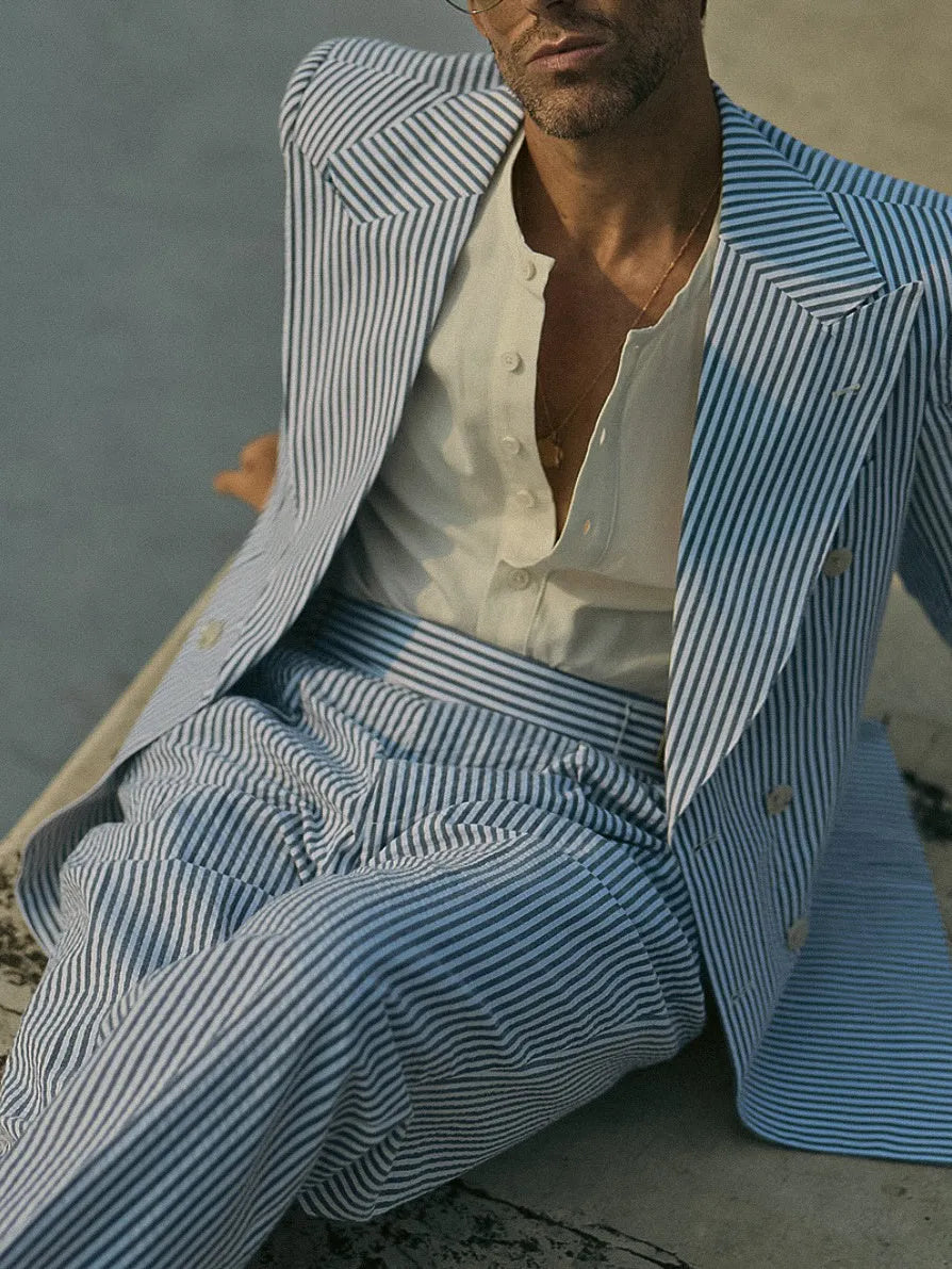 Blue and white striped polyester suit set showing blazer and matching trousers for formal wear