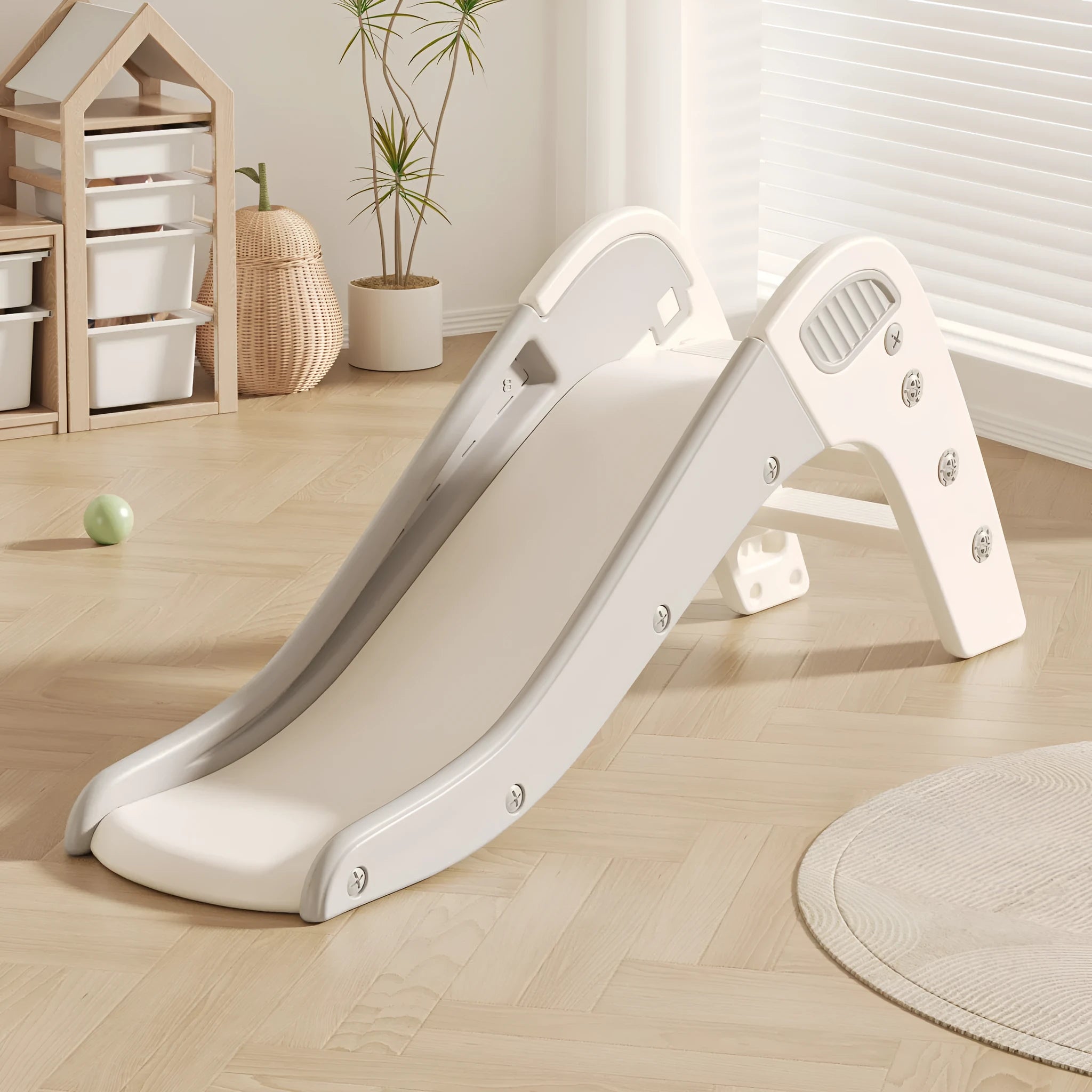 Small colourful plastic baby slide for toddlers under three years old.