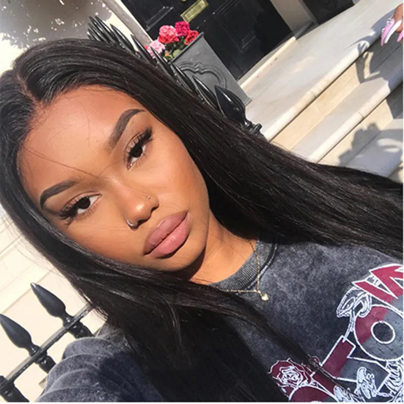 Long straight black synthetic wig with centre-parted bangs on mannequin head