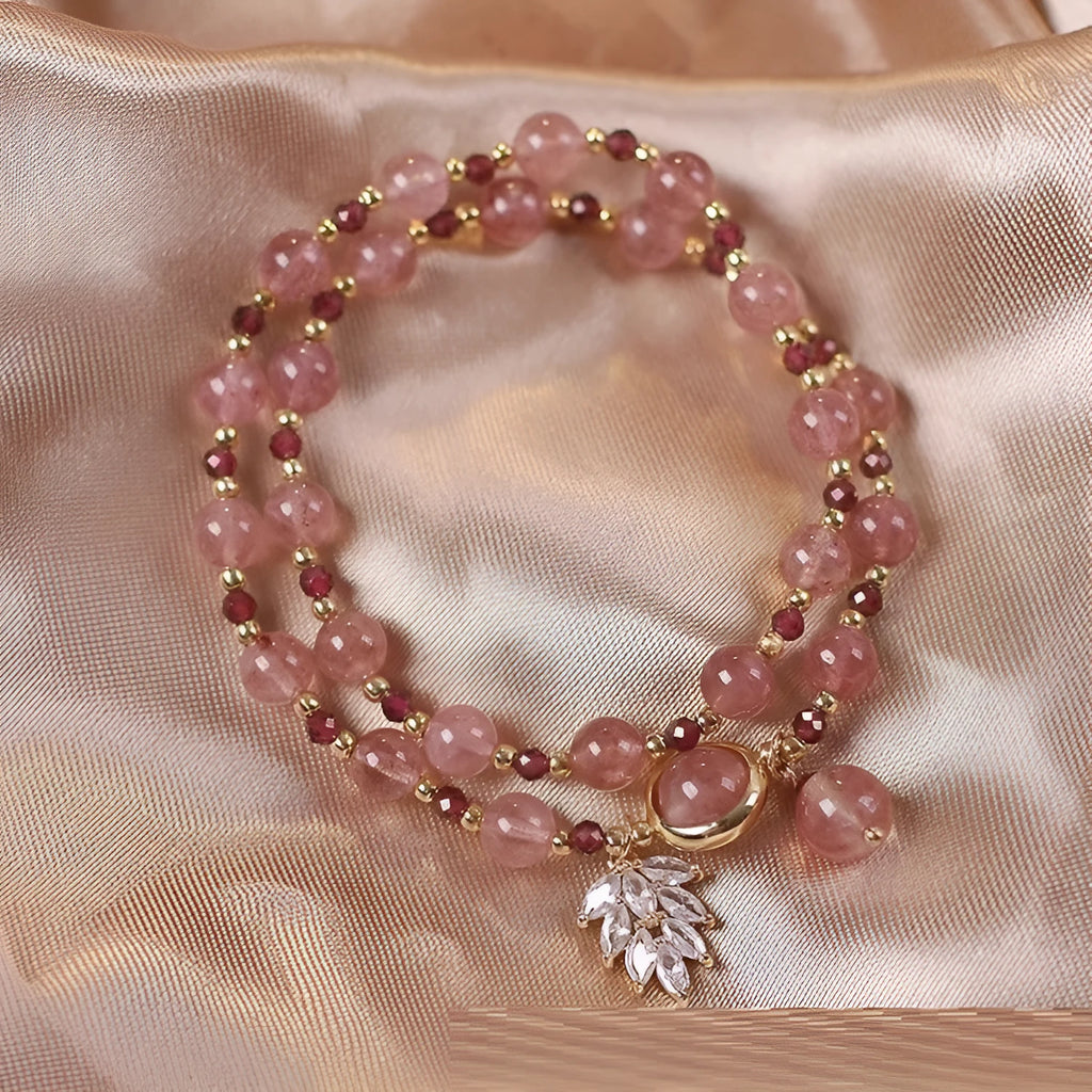 Women's double circle crystal bracelet with flower-shaped crystal detail in Strawberry Quartz colour